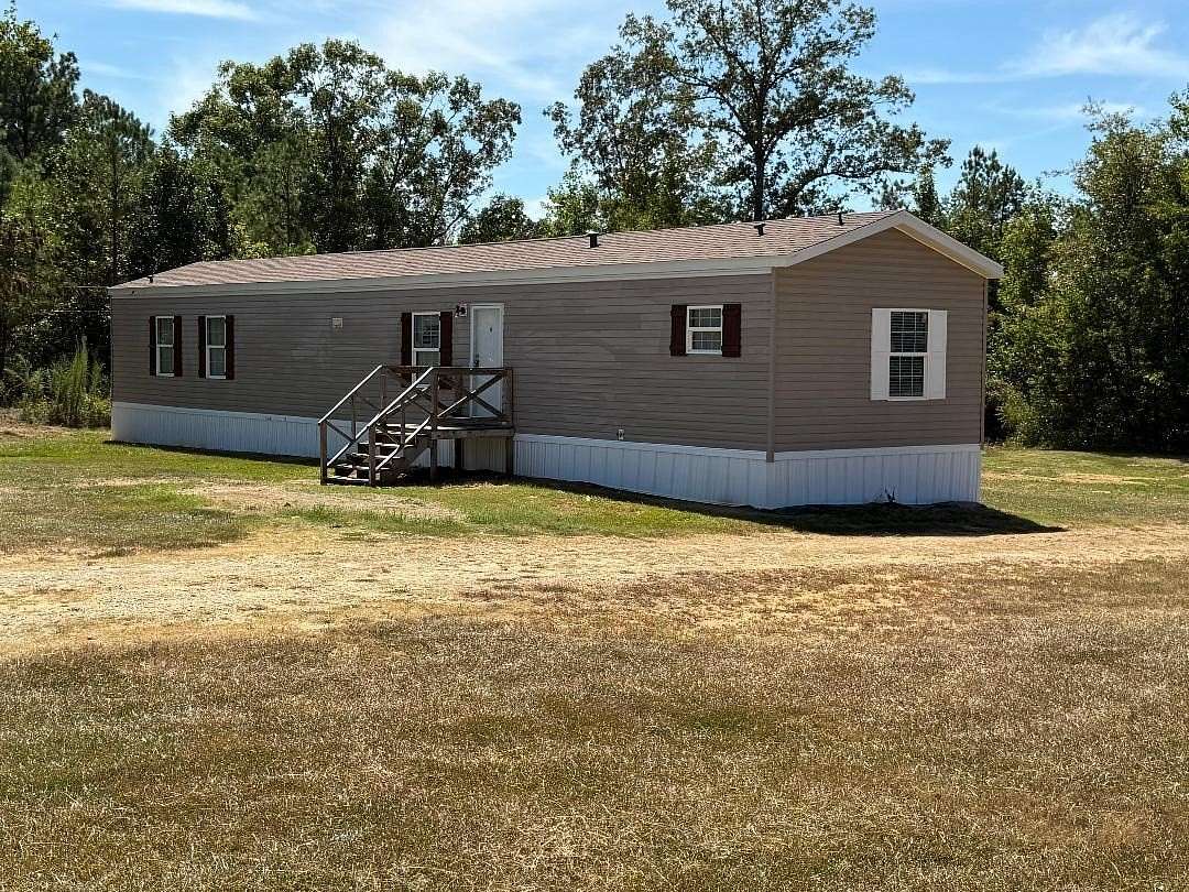 3 Acres of Land with Home for Sale in Adamsville, Tennessee
