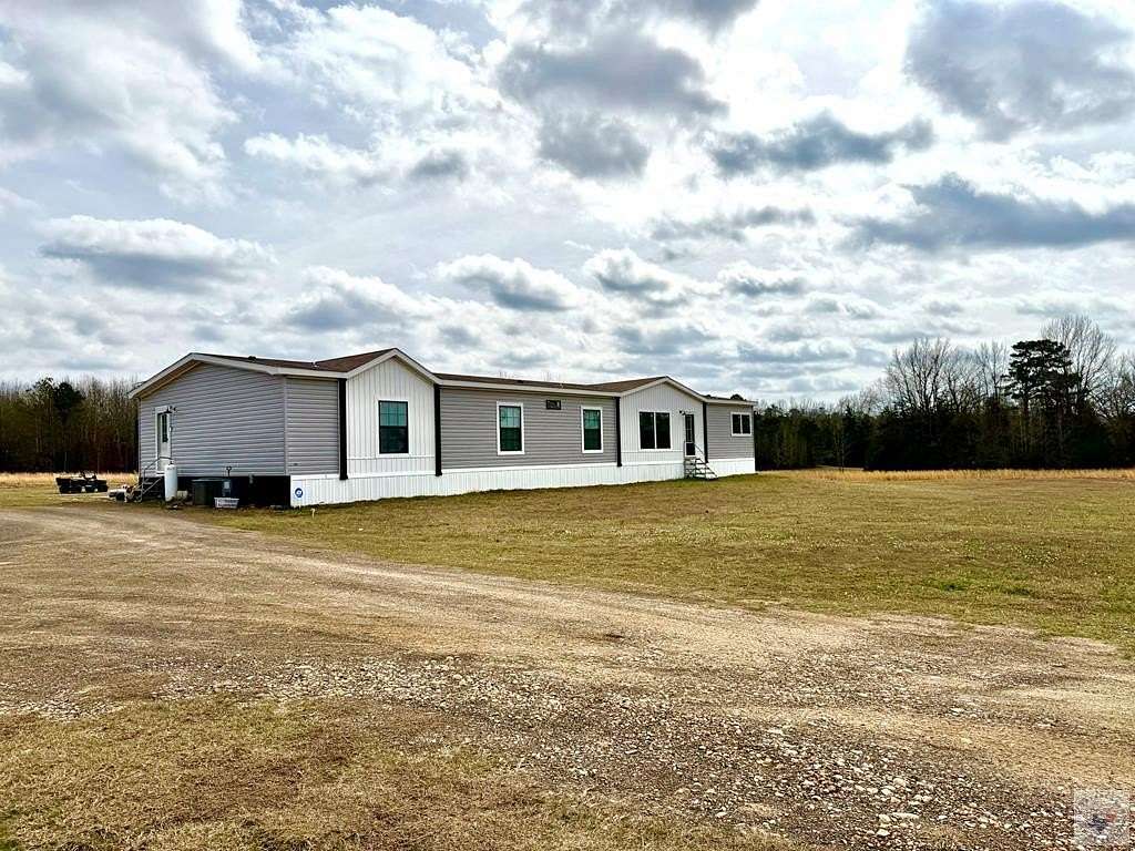 14.5 Acres of Land with Home for Sale in Atlanta, Texas