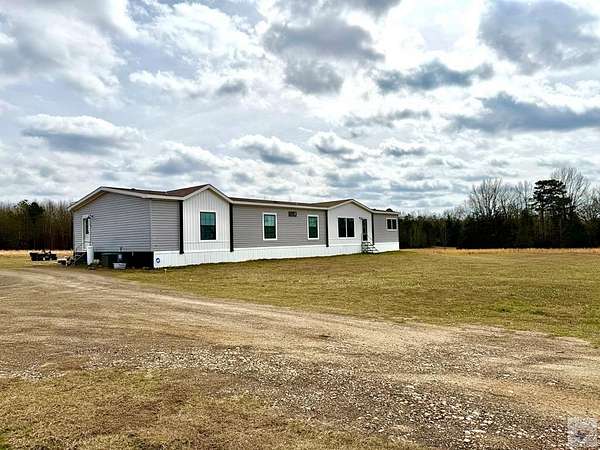 14.5 Acres of Land with Home for Sale in Atlanta, Texas