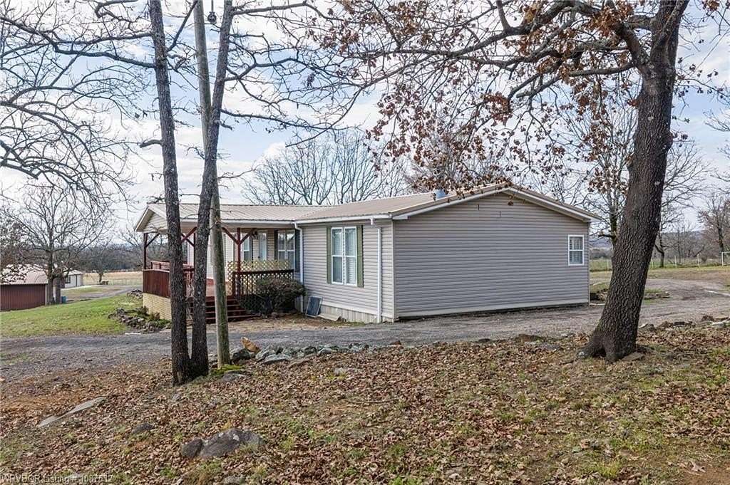 7.65 Acres of Land with Home for Sale in Hackett, Arkansas