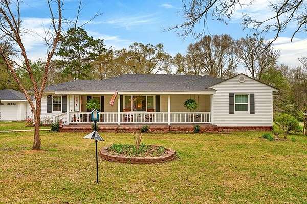 23.2 Acres of Recreational Land with Home for Sale in Carriere, Mississippi