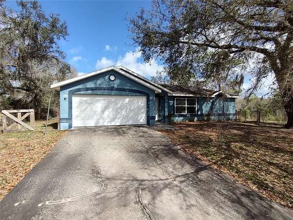 3.34 Acres of Land with Home for Sale in De Leon Springs, Florida