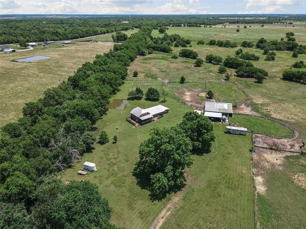65.4 Acres of Land with Home for Sale in Wolfe City, Texas