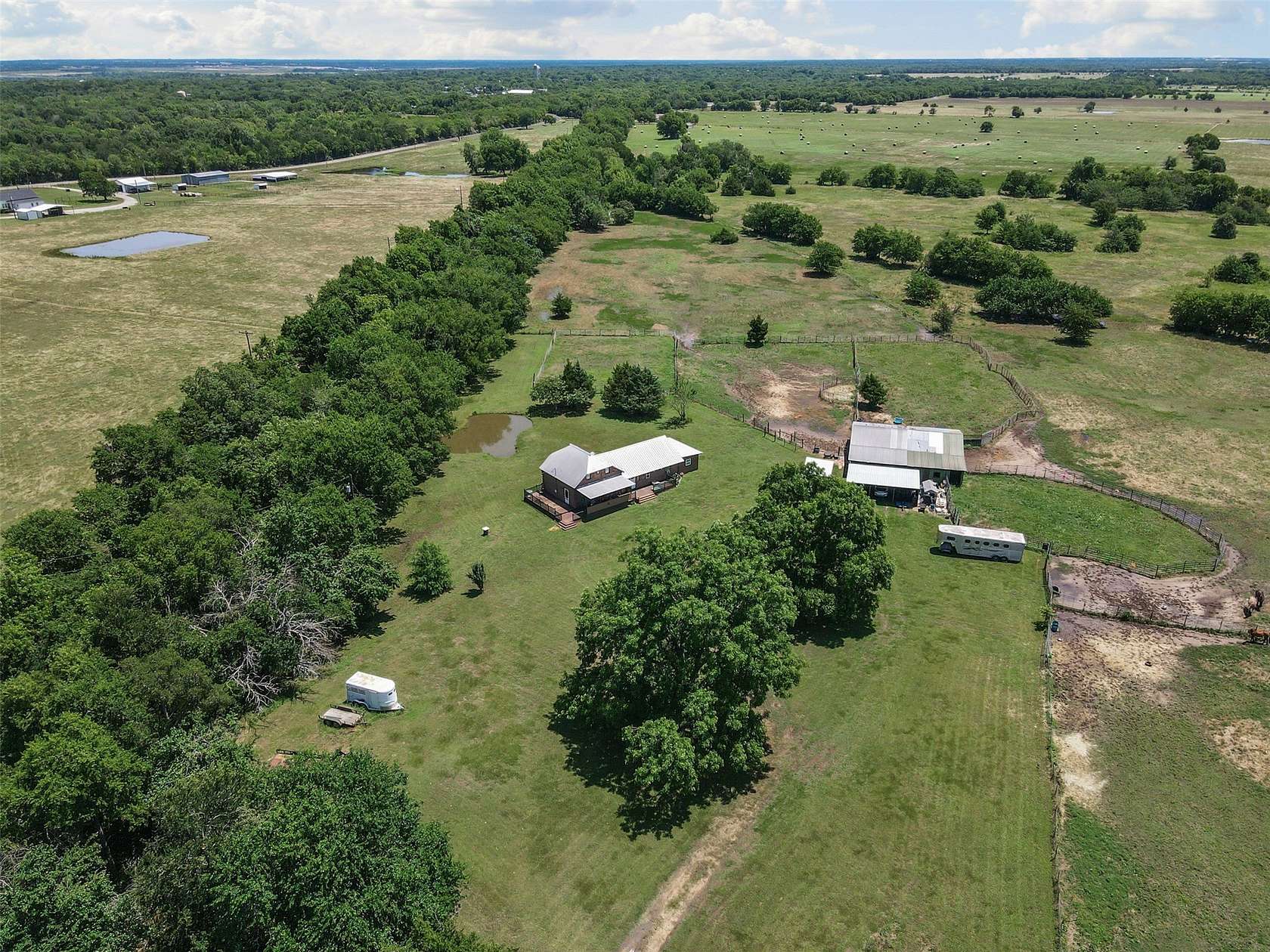 65.4 Acres of Land with Home for Sale in Wolfe City, Texas