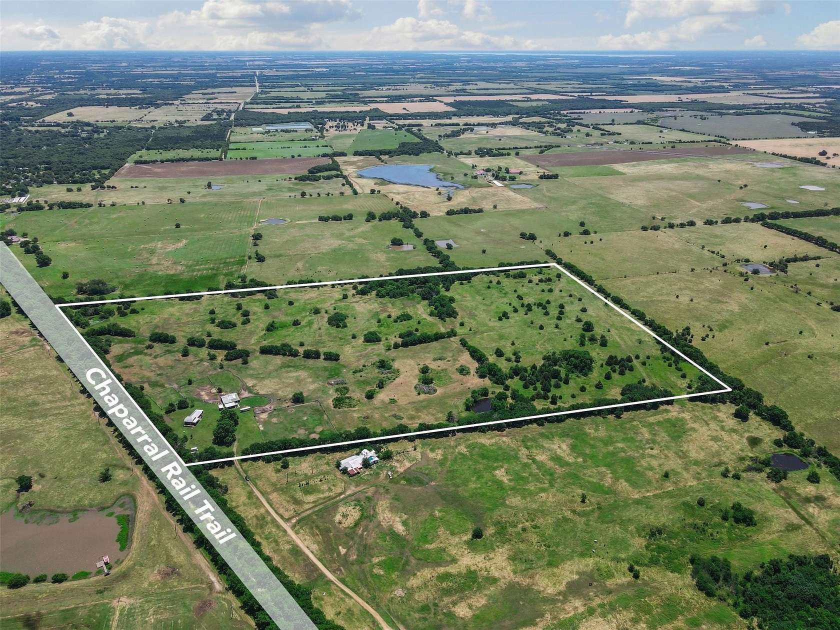 65.4 Acres of Land with Home for Sale in Wolfe City, Texas