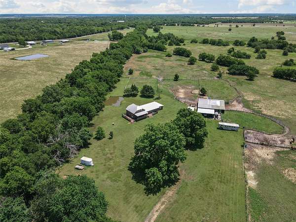 65.4 Acres of Land with Home for Sale in Wolfe City, Texas