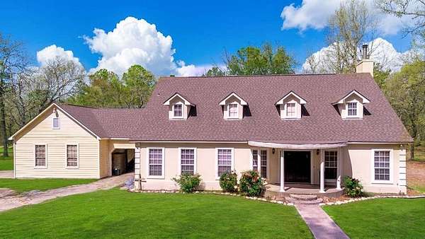 9.72 Acres of Land with Home for Sale in Groveton, Texas