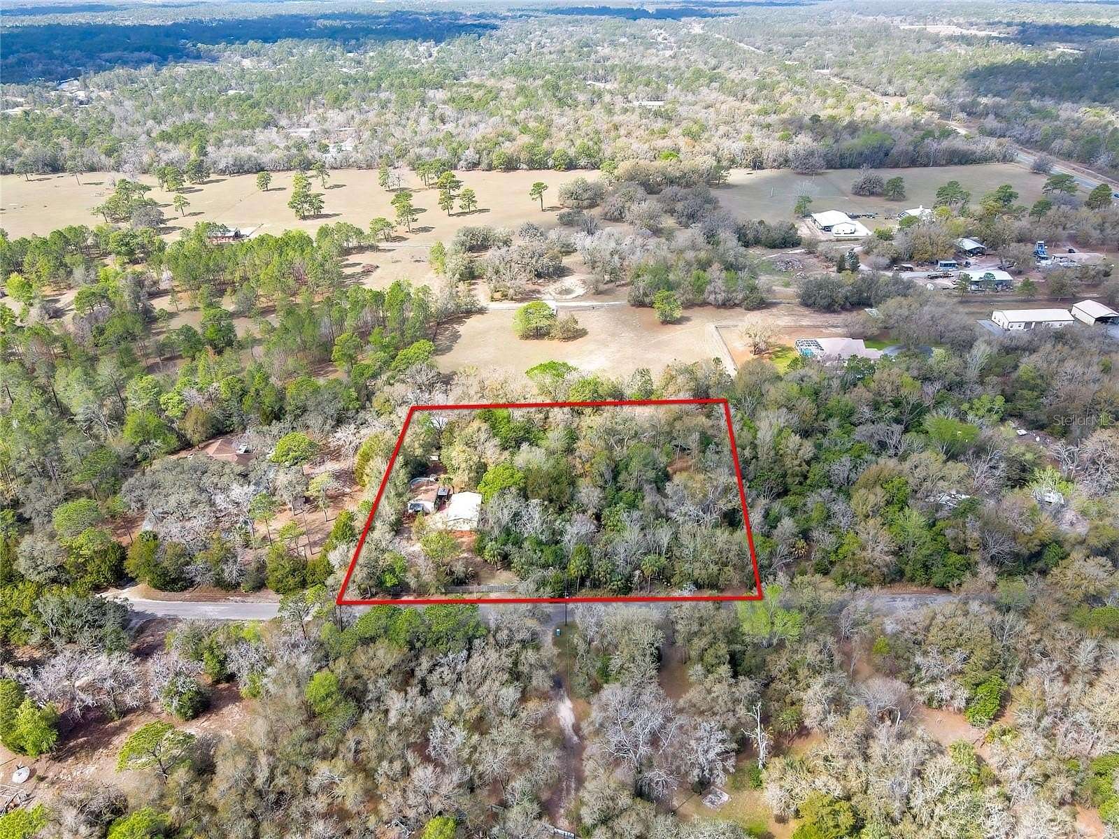 2.5 Acres of Land with Home for Sale in Weeki Wachee, Florida