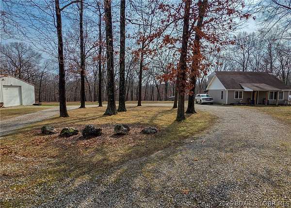 6.46 Acres of Land with Home for Sale in Gravois Mills, Missouri