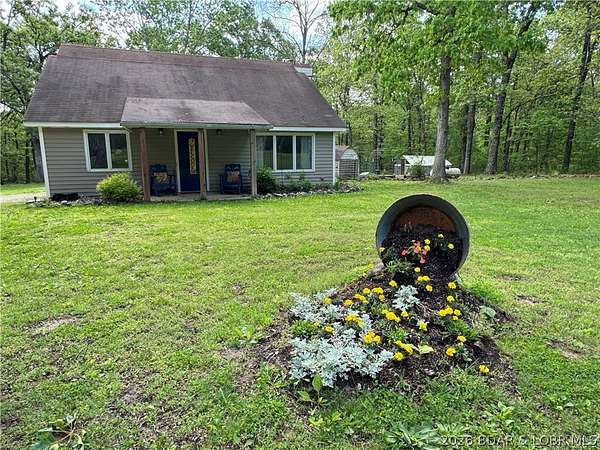 6.46 Acres of Land with Home for Sale in Gravois Mills, Missouri