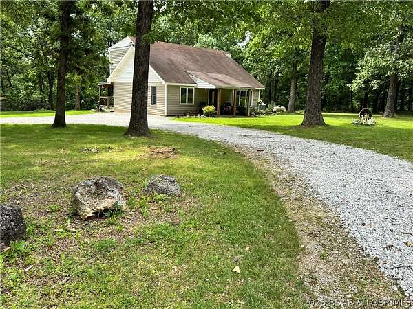 6.46 Acres of Land with Home for Sale in Gravois Mills, Missouri