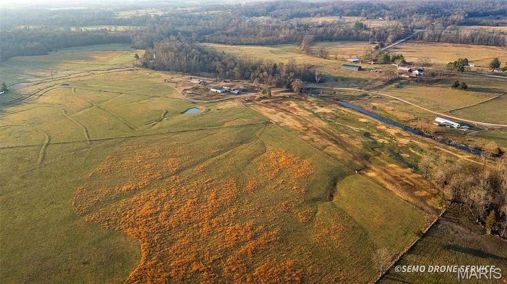 211 Acres of Agricultural Land with Home for Sale in Patterson, Missouri