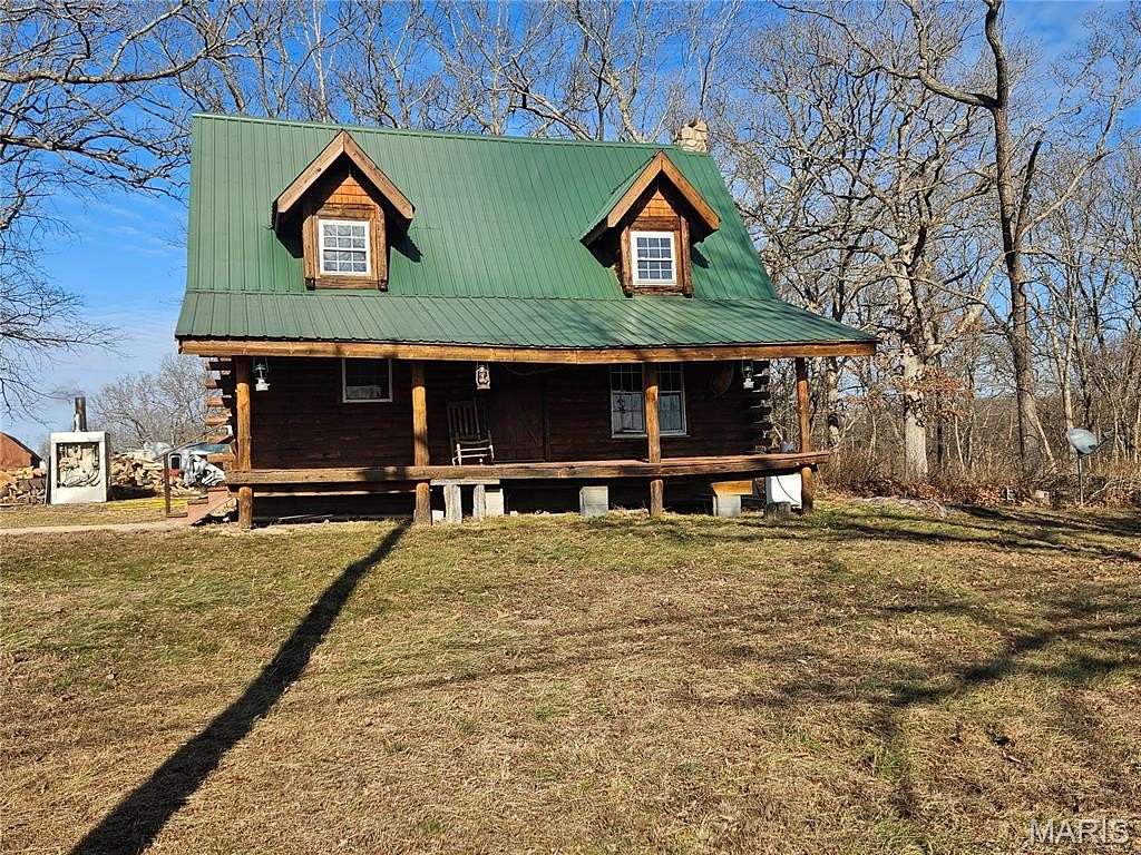 6.4 Acres of Land with Home for Sale in Devils Elbow, Missouri