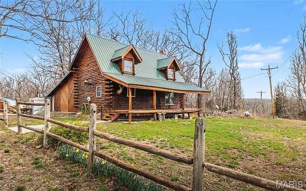 6.4 Acres of Land with Home for Sale in Devils Elbow, Missouri