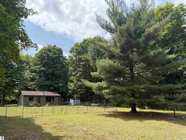 25.4 Acres of Recreational Land with Home for Sale in Beulah, Michigan