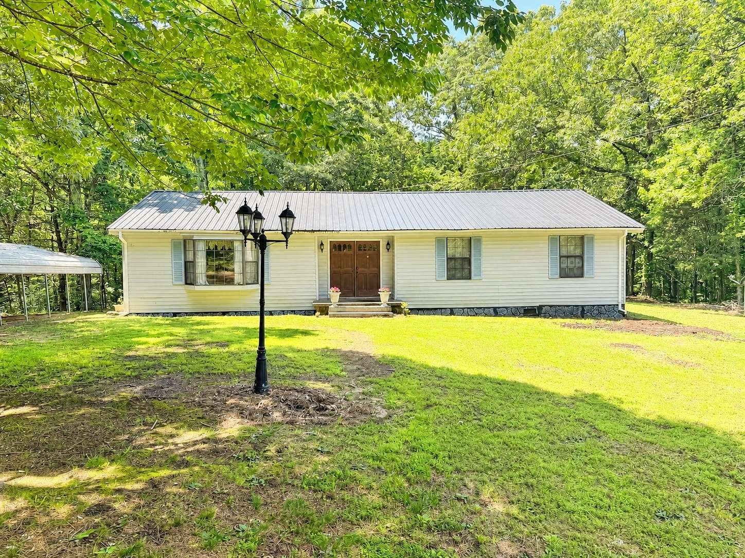48 Acres of Recreational Land with Home for Sale in Buena Vista, Tennessee