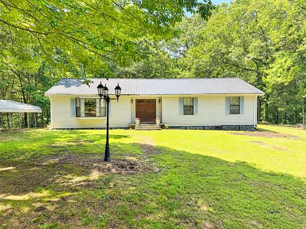 48 Acres of Recreational Land with Home for Sale in Buena Vista, Tennessee