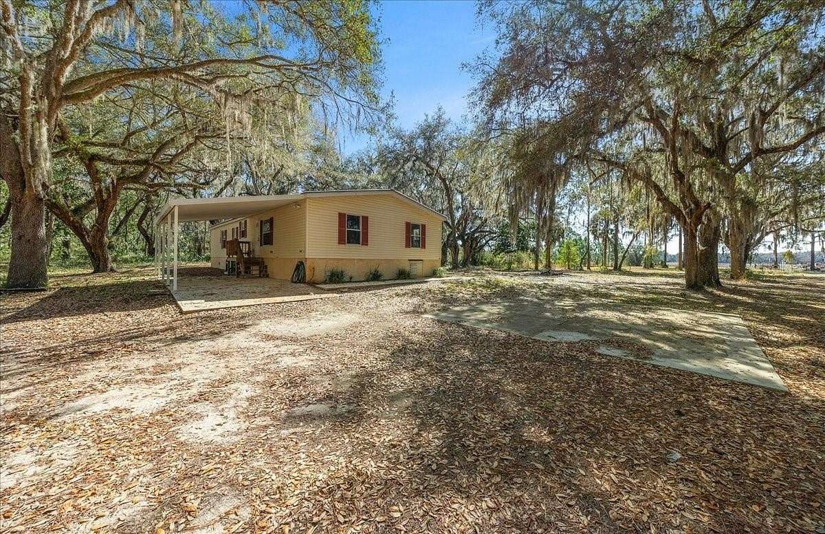 12.8 Acres of Land with Home for Sale in Citra, Florida
