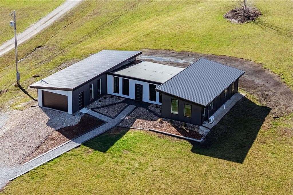 5.88 Acres of Land with Home for Sale in Harrisonville, Missouri