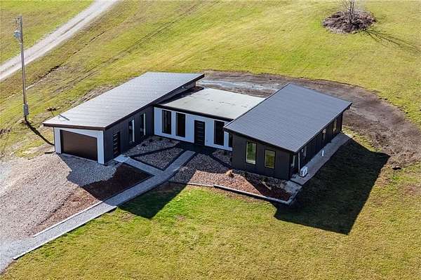 5.88 Acres of Land with Home for Sale in Harrisonville, Missouri