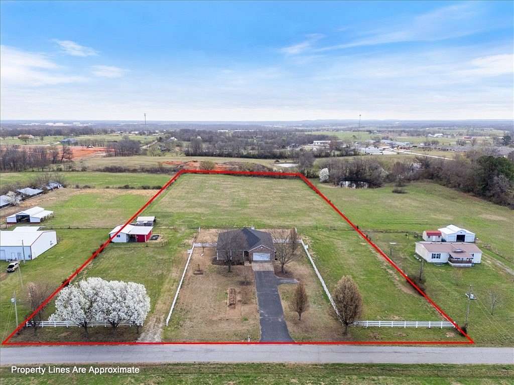 5.66 Acres of Land with Home for Sale in Gentry, Arkansas
