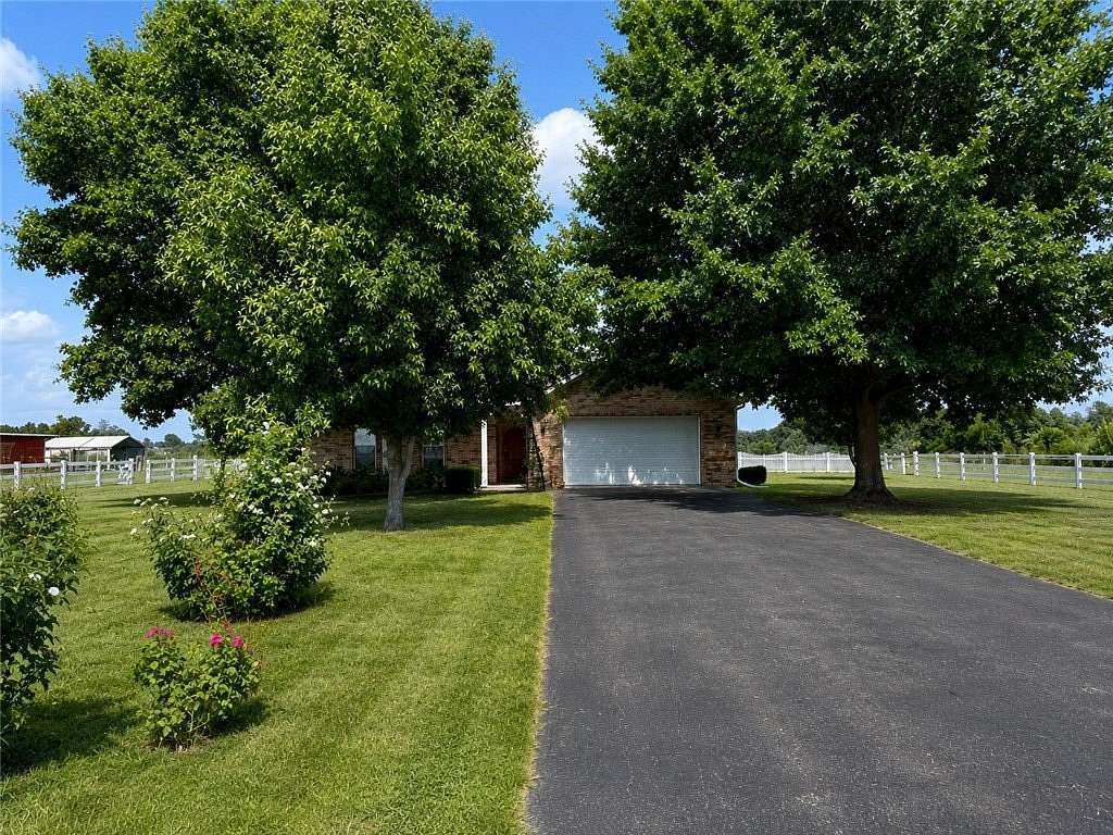 5.66 Acres of Land with Home for Sale in Gentry, Arkansas