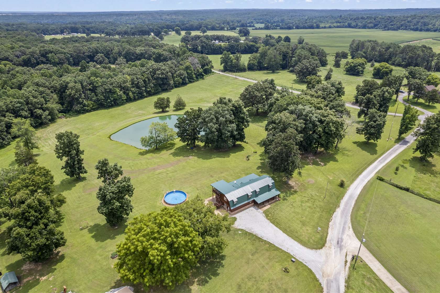 10 Acres of Land with Home for Sale in Holladay, Tennessee