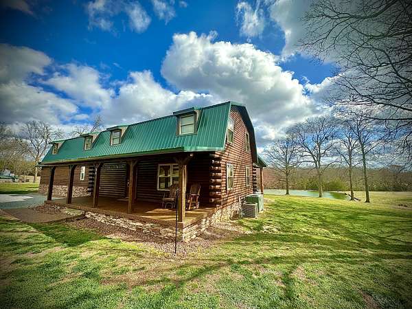 20 Acres of Recreational Land with Home for Sale in Holladay, Tennessee