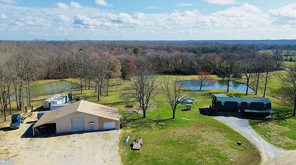 20 Acres of Recreational Land with Home for Sale in Holladay, Tennessee