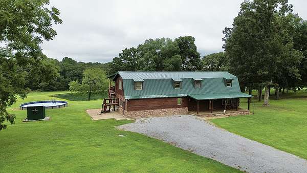 10 Acres of Land with Home for Sale in Holladay, Tennessee