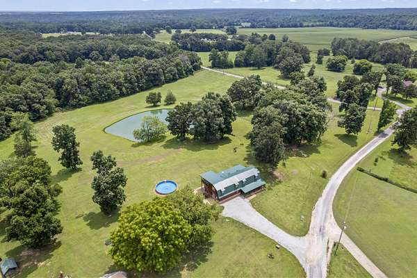 10 Acres of Land with Home for Sale in Holladay, Tennessee
