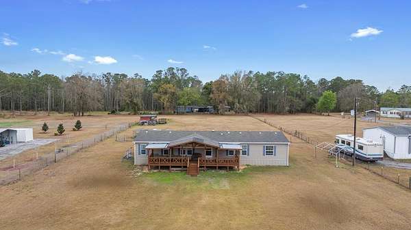 2.23 Acres of Land with Home for Sale in Polk City, Florida