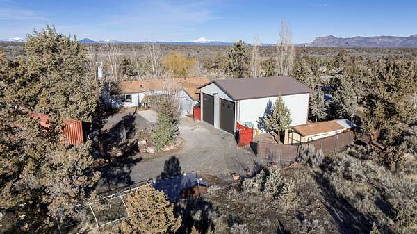 5.89 Acres of Land with Home for Sale in Powell Butte, Oregon