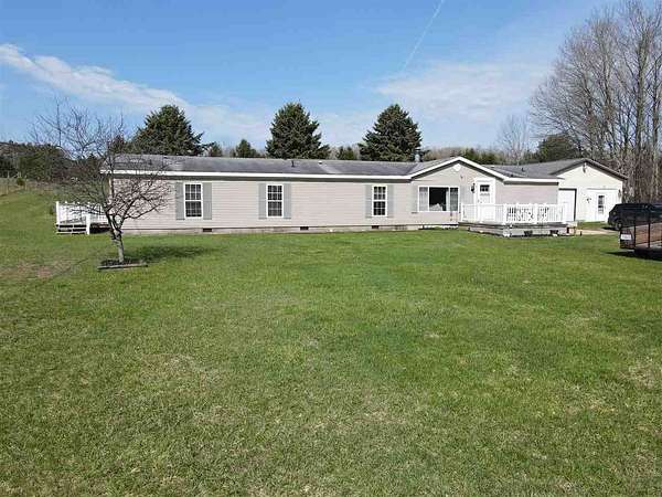 5 Acres of Land with Home for Sale in East Jordan, Michigan