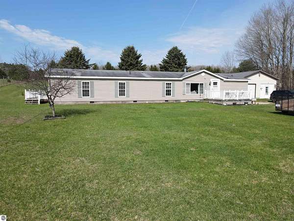 5 Acres of Land with Home for Sale in East Jordan, Michigan