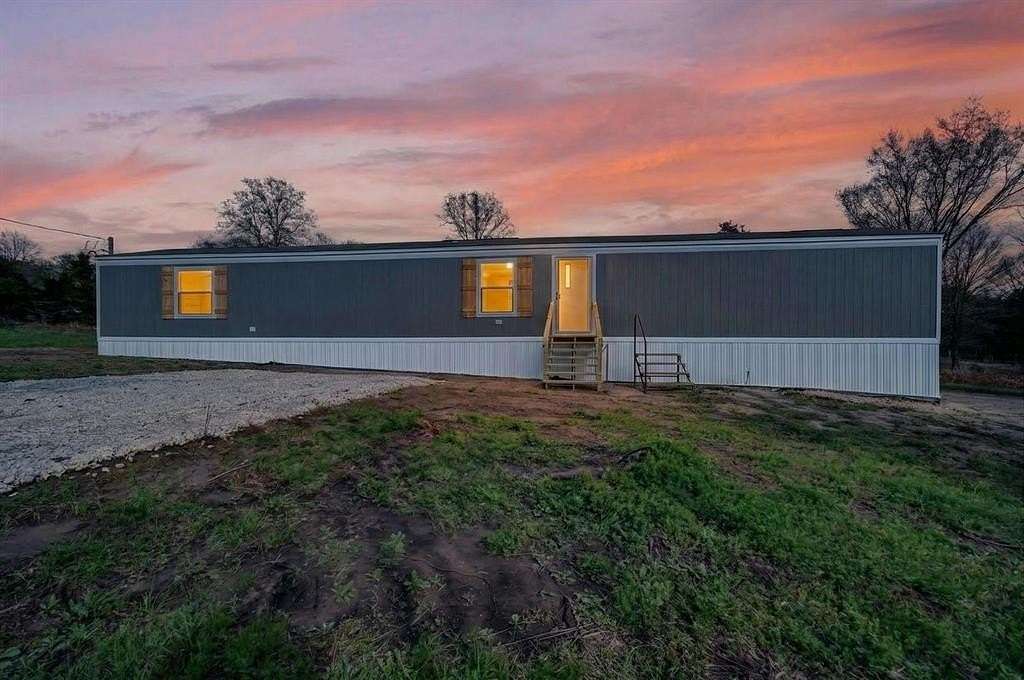 1.31 Acres of Land with Home for Sale in Quinlan, Texas