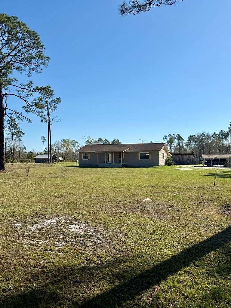 7.62 Acres of Land with Home for Sale in Du Pont, Georgia