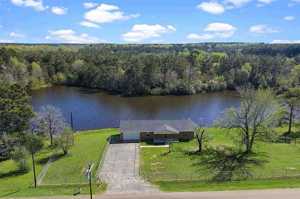 22 Acres of Recreational Land with Home for Sale in Carthage, Texas