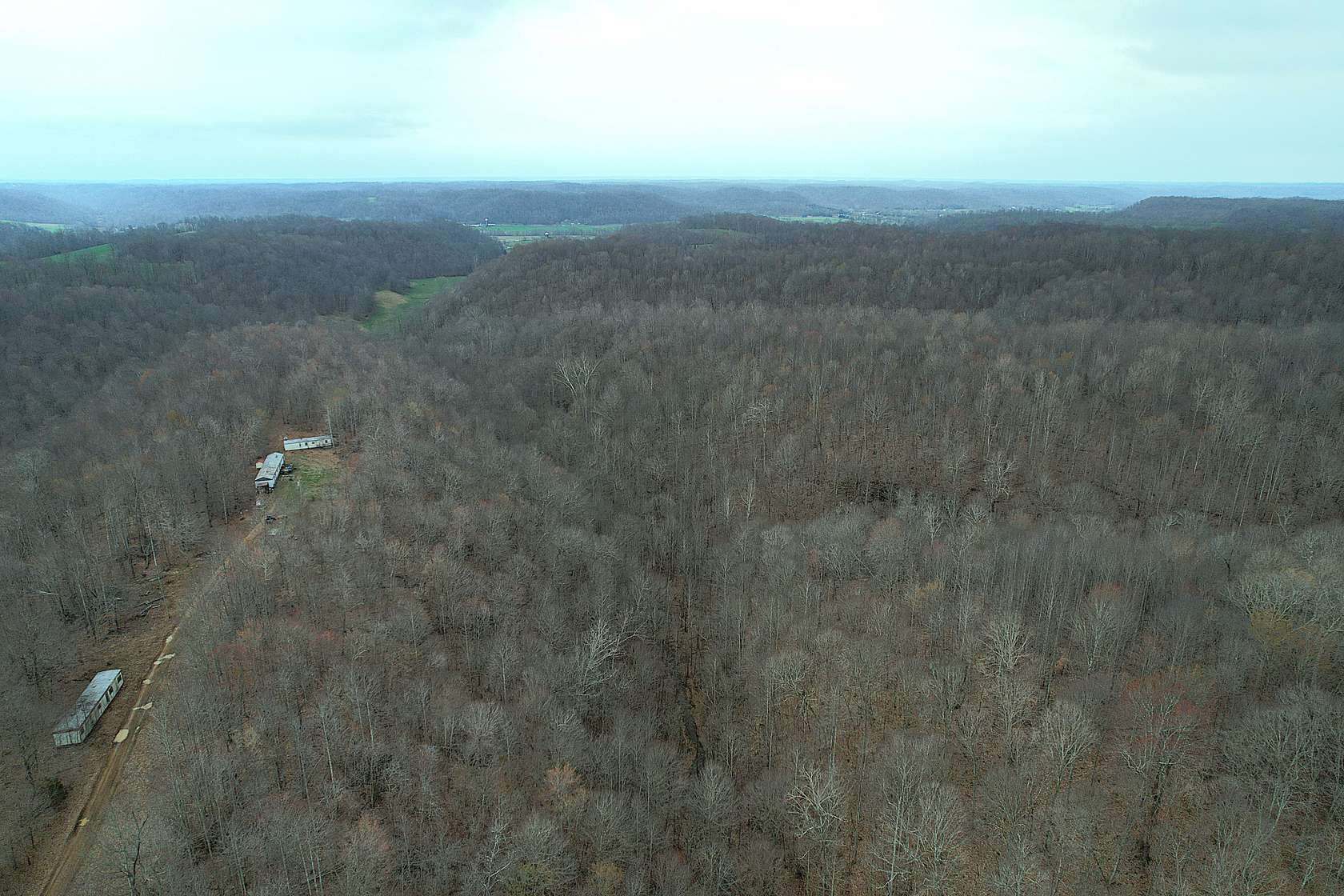 78.5 Acres of Land with Home for Sale in Liberty, Kentucky
