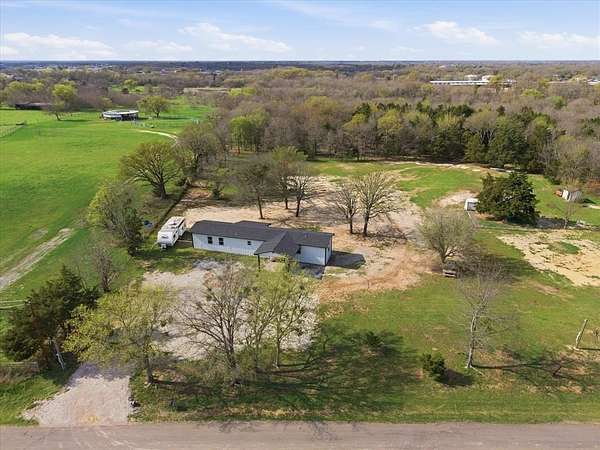 1.5 Acres of Land with Home for Sale in Royse City, Texas