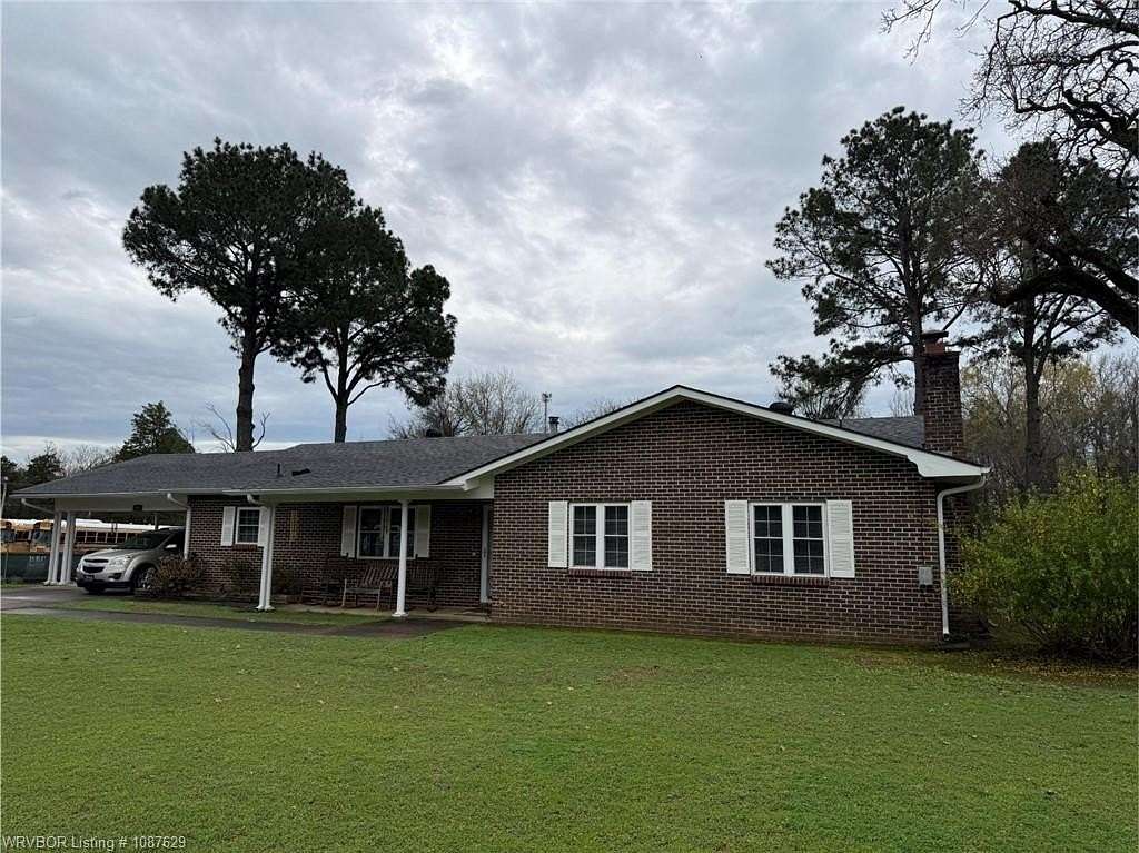 1.64 Acres of Land with Home for Auction in Clarksville, Arkansas