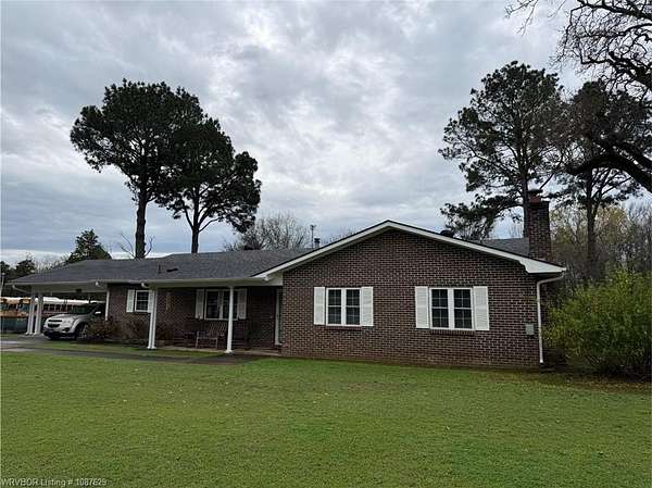 1.64 Acres of Land with Home for Auction in Clarksville, Arkansas