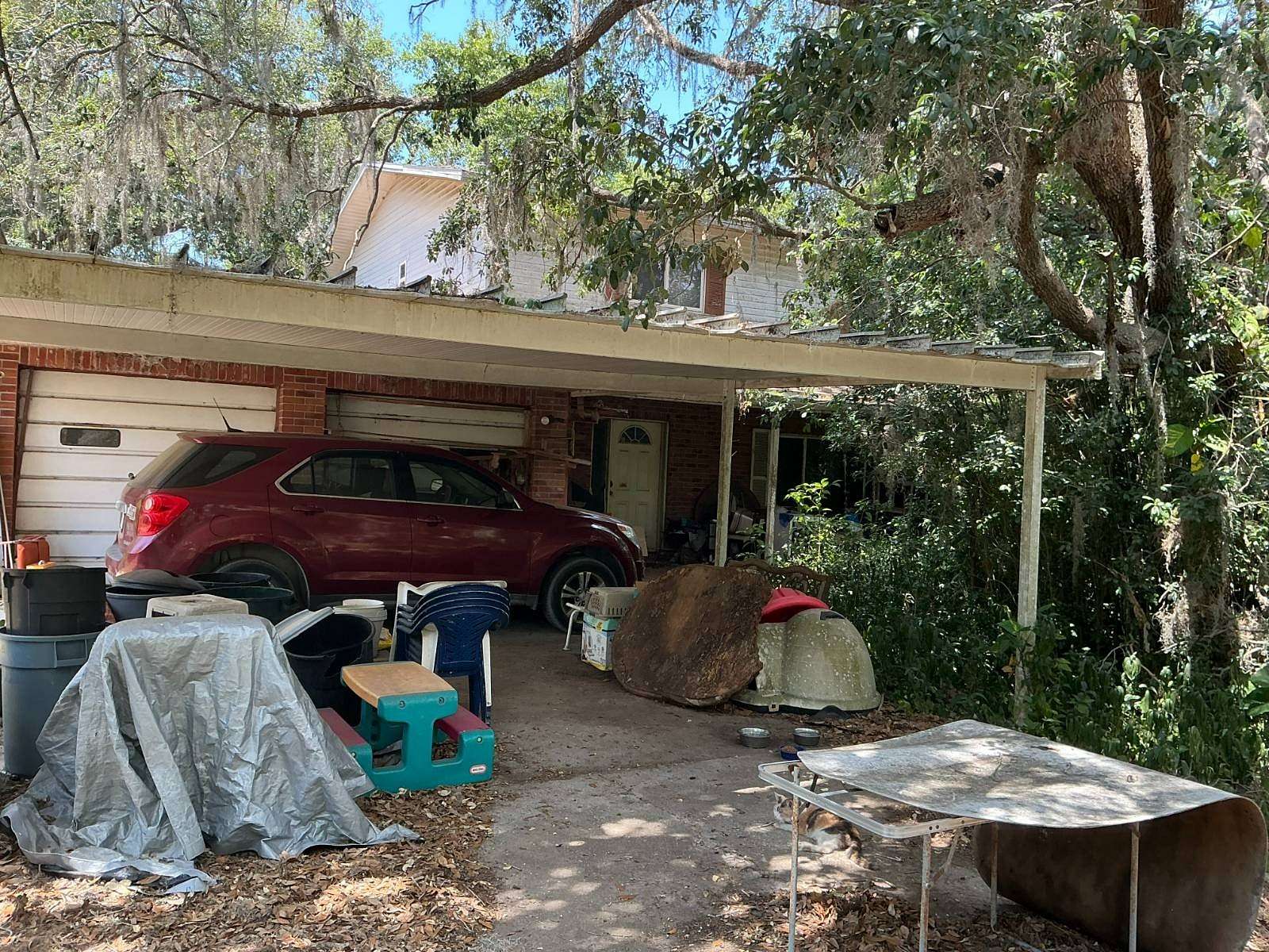 2.55 Acres of Land with Home for Auction in Zephyrhills, Florida