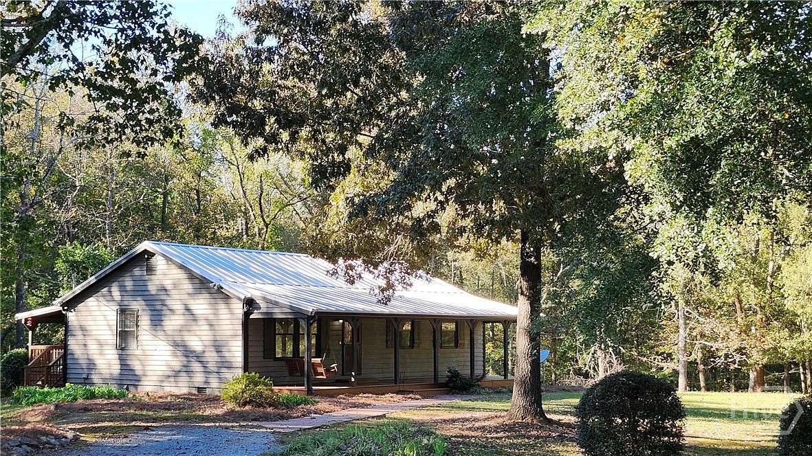 3.66 Acres of Land with Home for Sale in Arnoldsville, Georgia