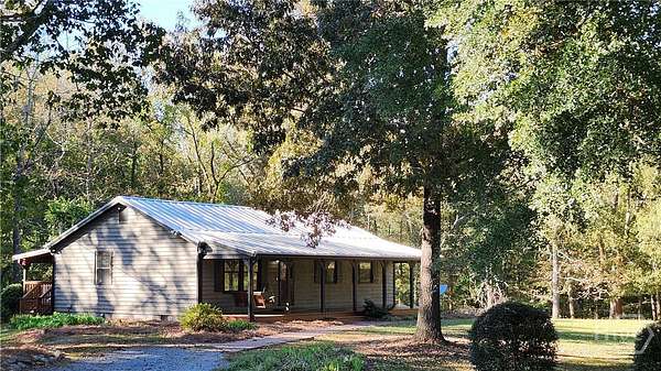 3.66 Acres of Land with Home for Sale in Arnoldsville, Georgia