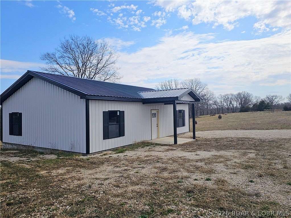 6.5 Acres of Land with Home for Sale in Barnett, Missouri