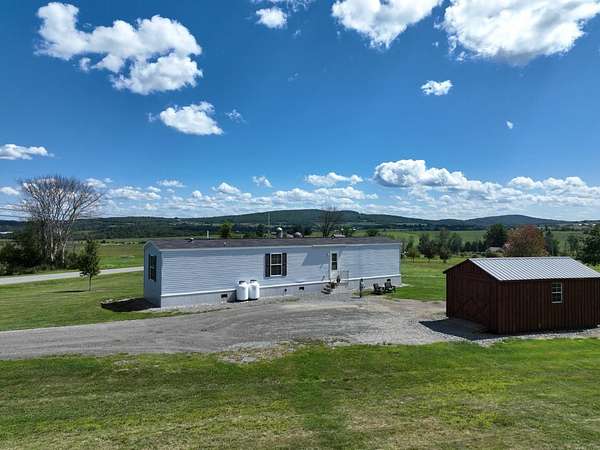 10.2 Acres of Recreational Land with Home for Sale in Newport Town, Vermont
