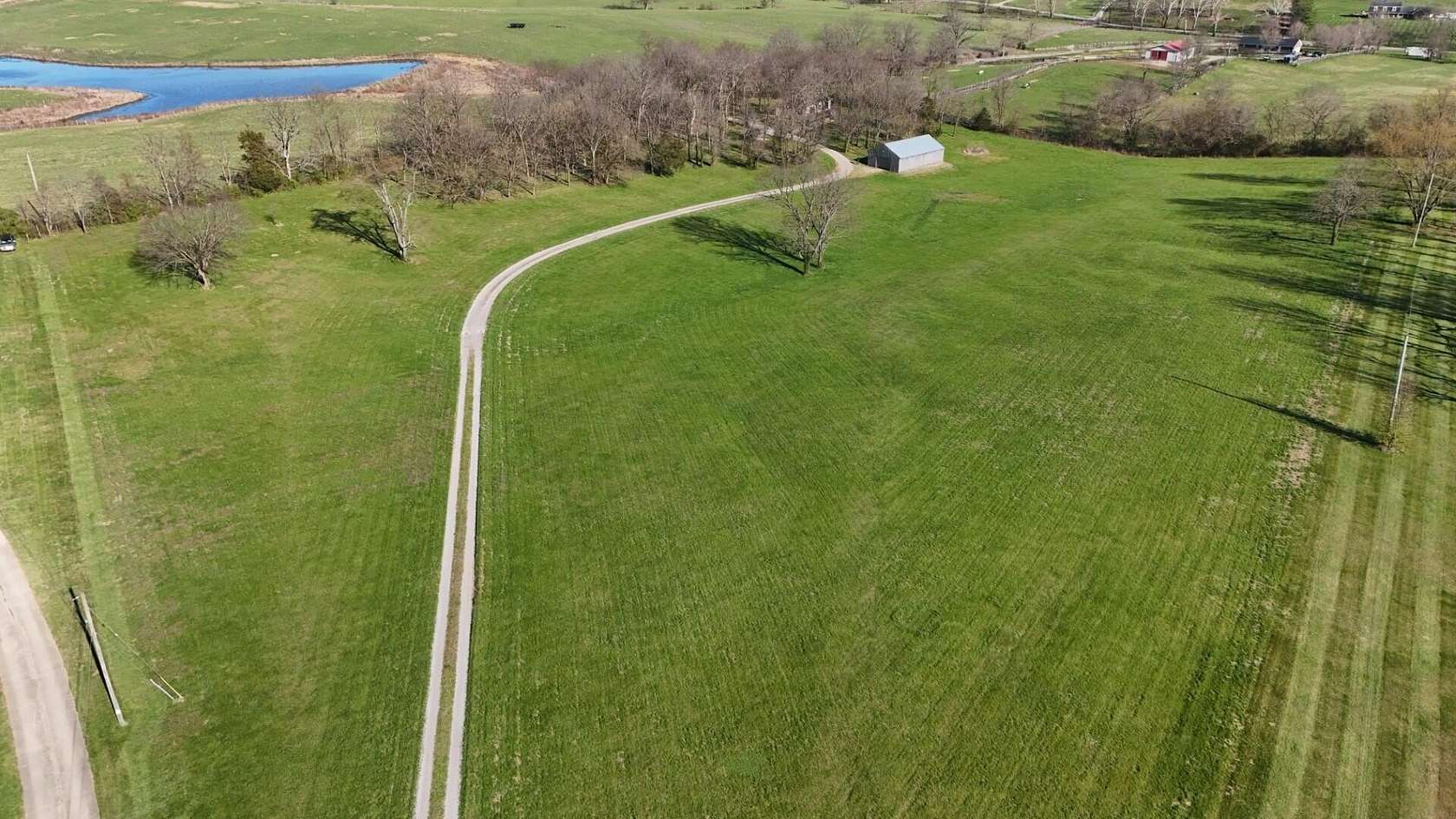 10.8 Acres of Land with Home for Auction in Stamping Ground, Kentucky