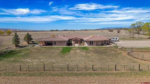 30.2 Acres of Agricultural Land with Home for Sale in Hotchkiss, Colorado