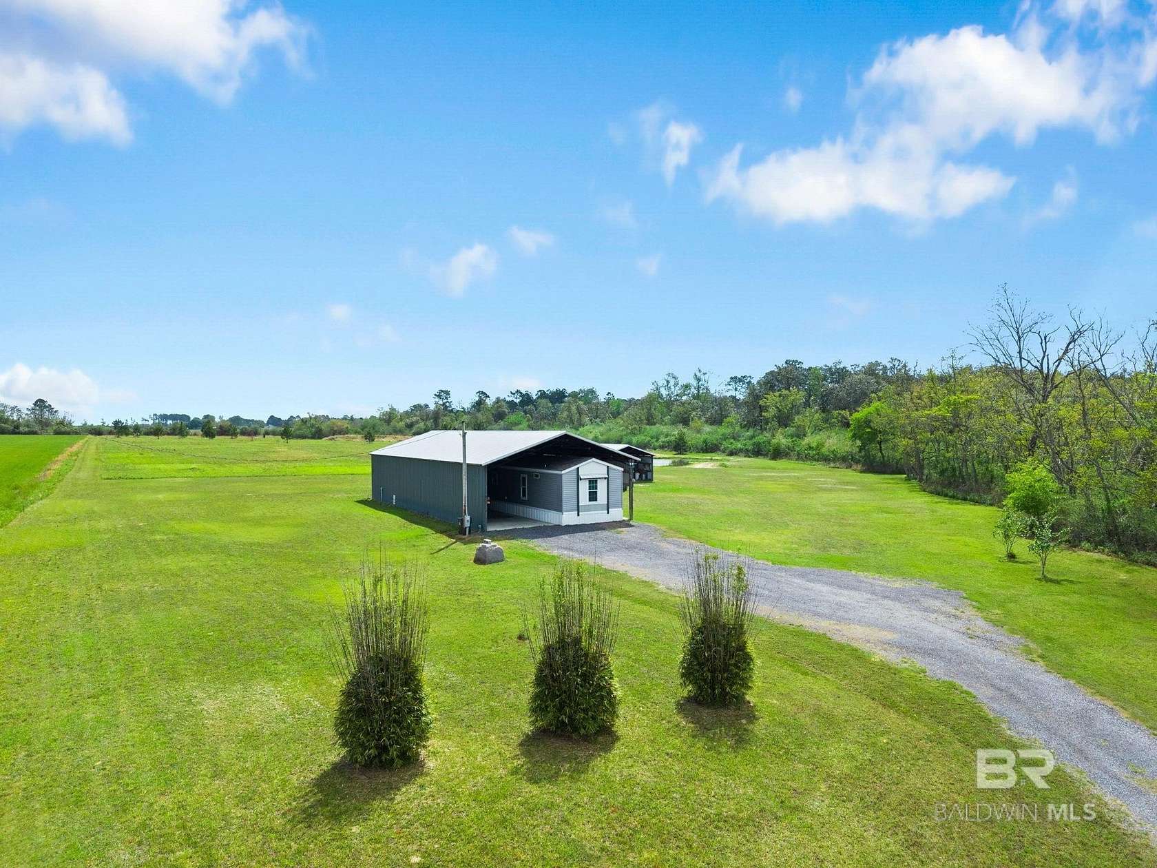 14.7 Acres of Land with Home for Sale in Elberta, Alabama